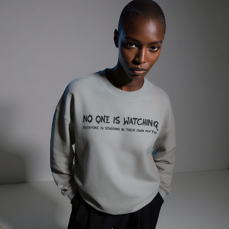 Long sleeve tee with 'No One Is Watching' text print across the chest
